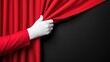© Mariia - Red theater curtain opened by hand in white glove on dark background. World Theatre Day concept. Elegant horizontal banner with copy space for text, drama and stage performance theme