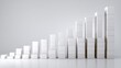 © Sawat - White geometric shapes stacked in ascending manner depicting growth and progress in business or finance sector
