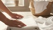 © 행운 행 - Hand Folding Clean White Towels for Housekeeping and Hospitality Service 가사 서비스와 환대 서비스를 위해 깨끗한 흰 수건을 정성스럽게 접는 사람의 손