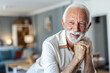 © Jelena Stanojkovic - Retirement man and relax portrait with attractive and happy smile resting in house. Senior, elderly and positive men at home enjoying leisure break and pension lifestyle.
