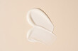 © ADDICTIVE STOCK - Cosmetic swatches on beige background