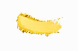© tatyanarow - Eye shadow matte yellow yolk texture background white isolated backdrop. Beauty product sample swatch