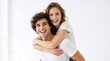 © Vasiliy - Joyful young couple laughing during a piggyback ride. Happy man and woman in white t-shirts against a white background. Love and relationship concept