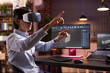 © DC Studio - Asian male entrepreneur working from home, using vr glasses and computer aided design software for architectural products. Young man with virtual reality headset, modifying 3d prototype models.