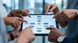 © Yuliia - Business team analyzing data charts on tablet device during corporate meeting in modern office environment for strategic planning and decision making.