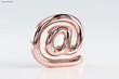 © Elif Taran - Rose Gold Metallic At Sign Symbol on Light Background