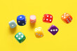 © Pixel-Shot - Flying colorful game dices on yellow background