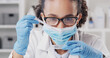 © peopleimages.com - Woman, scientist and dropper with sample at lab for medical research, glasses and virus in petri dish. Person, equipment and face mask with fluid for pharmaceutical study, test or vaccine development