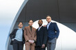© VISTA by Westend61 - Confident business professionals in formal wear standing in Barcelona