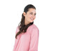 © wavebreak3 - Woman smiling, looking right, posing in studio in pink longsleeve top, studs, hair-tie, copy space