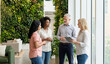 © Vika art - Diverse business team collaborating in sustainable green wall office