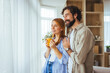 © Dragana Gordic - Happy Young Couple Enjoying Morning Coffee Together At Home With Window Light And Cozy Interiors