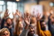 © filmanana - Community Hall Engagement Diverse Audience Raising Hands in