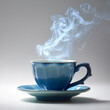 © Анна Ясониди - Steaming blue cup of coffee on saucer against neutral background