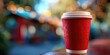 © Anatoll Paveel - Red cup of coffee. Bokeh. Blurred background.