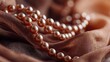 © Anatoll Paveel - Beautiful pearl necklace made of brown silk, close-up.