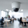 © Andrii Zastrozhnov - Surveillance camera in modern office with blurred employees working in background