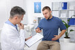 © New Africa - Man having appointment with urologist in clinic