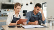 © AucArtStudio - Sad small business owner worry in cafe, business partner stressed over finance