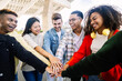© Xavier Lorenzo - Group of cheerful gen z students standing together, holding hands as a sign of support and togetherness. Youth lifestyle concept.