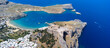 © Esin Deniz - The Acropolis of Lindos in Rhodes island Greece. Saint Paul's Beach and Lindos Acropolis aerial panoramic view.