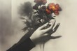 © Margarita Ratatosk - Womans hand holding vibrant red flower with shadows on muted background. Femininity and sensual beauty concept for International Womens Day.