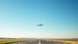 © Jim - runway. A solitary airplane flying high in a clear blue sky above a softly focused airport runway. mobility guides, transit brochures, designed for mobility and urban transit guides.