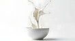 © Petro - Dynamic splash of milk captured mid-air from a white bowl, creating a refreshing and vibrant visual.