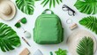 © afif - Green backpack, summer travel essentials, tropical leaves