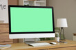 © Pixel-Shot - Modern computer with blank screen on table in home office