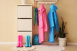 © Pixel-Shot - Interior of hallway with raincoats, gumboots and drawers