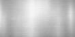 © LumenCraft - A polished silver stainless steel plate showcases a shiny brushed metal texture with a gray industrial aluminum pattern reflecting on the metallic surface of this high-quality alloy material wallpaper