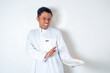© rukuta.project - Muslim man refusing food while holding plate wearing white thobe isolated on white background. Rejection, dislike and refusal concept.