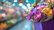 © RUHAN - A vibrant bouquet of flowers in a purple shopping bag