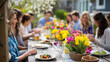 © Nataliya - Colorful outdoor spring brunch gathering with friends around a garden table, social weekend brunch, spring outdoor dining, friend group weekend meal, garden party lifestyle, defocused