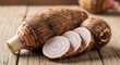 © Suroto - Exotic taro root composition with slices on a rustic wooden backdrop