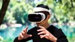 © mila103 - Man using virtual reality headset reaching hands by lake.