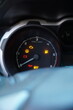 © Gaston - Close-up of a car dashboard with multiple warning lights illuminated, including check engine, battery, and oil pressure icons, signifying mechanical trouble.