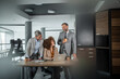 © Migma_Agency - Business colleagues collaborating on a project in a modern office