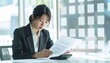 © SoftFlower - 税金書類を見つめる会社員の不安, Office Worker Worried About Tax Documents