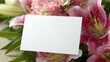 © red_orange_stock - Blank card placed among pink flowers and green leaves for messages