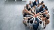© PixieSnaps - Overhead View of Diverse Business Team with Hands Together, Multicultural Professionals Showing Unity, Collaboration, Teamwork, Leadership and Inclusion Concept