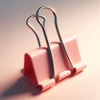 © Hamr - Creative workspace essential in warm soft lightingChic pink paper holder with glossy metal armsModern desk tool reflecting simplicity and elegancePastel binder clip casting gentle shadow on surface