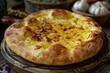 © juliars - Freshly baked traditional georgian khachapuri bread with melted cheese on rustic wooden board