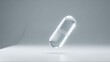 © Prince SUN - Isolated clear pharmaceutical capsule on light gray studio background