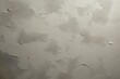 © sun - aged plaster wall with peeling paint and rough textured surface conveying a worn, weathered feeling