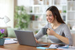 © PheelingsMedia - Happy tele worker drinking coffee working online