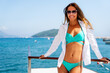© NDABCREATIVITY - Sun-kissed and protected, enjoying a healthy summer vacation with sunscreen, ocean breeze