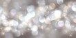 © 7sevenGr - シルバーとホワイトの柔らかなボケ味が美しい抽象的な背景素材で、キラキラと輝く光の粒子と星のようなスパークルがエレガントで華やかなお祝いや冬のイベント、クリスマスのデザインに最適な高品質なテクスチャ画像。