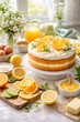 © Татьяна Евдокимова - Delicious homemade lemon layered cake featuring whipped cream frosting, fresh orange and lemon slices, mint leaves, and cheerful daisies, surrounded by baking ingredients under natural light
